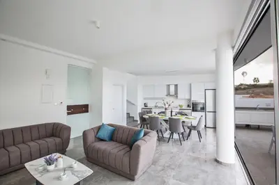 a living room with two couches and a table at Villa Prol24,brand New 2bdr Protaras Villa with Pool,close to Fig Tree Bay Beach in Protaras