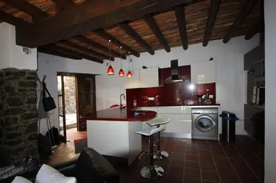 a kitchen with a counter and a stove top oven at River House in Kakopetria