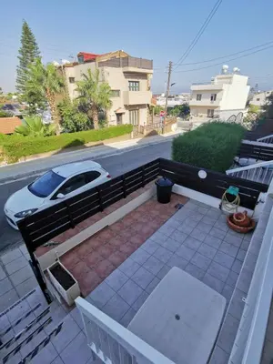 a white car is parked on a balcony at Oroklini Hideaway in Voroklini