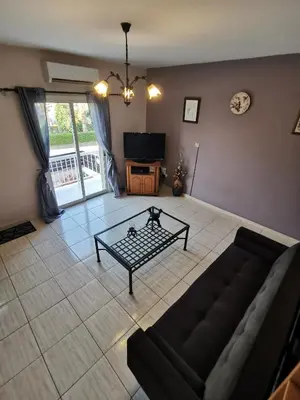 a living room with a couch and a coffee table at Oroklini Hideaway in Voroklini