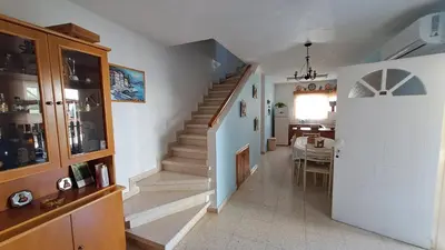 a hallway with stairs in a house at Manors Seaside 2BR House 100m from the Beach & Free Parking in Meneou