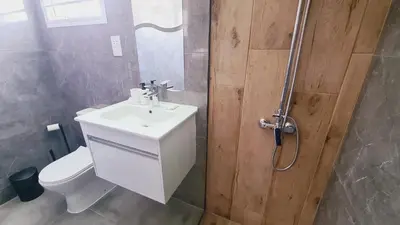 a bathroom with a toilet and a sink and a shower at Nissi avenue 64 Studio 3 - Luxcyservices in Ayia Napa