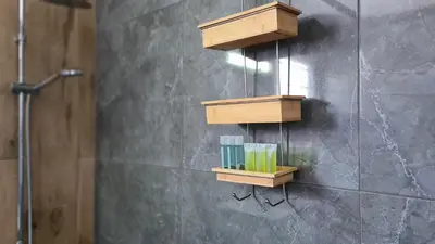 a bathroom with wooden shelves on the wall at Nissi avenue 64 Studio 3 - Luxcyservices in Ayia Napa