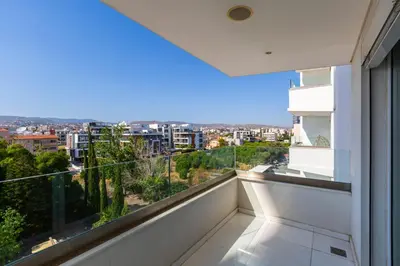 a balcony with a view of a city at Modern seafront apartment in Limassol