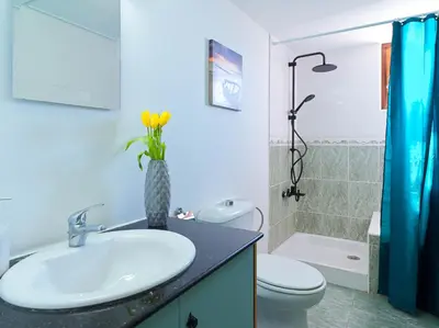 a bathroom with a sink and a toilet and a shower at Zima Two Seaside in Zygi