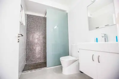 a bathroom with a shower with a toilet and a sink at Protaras Greco Villa CCV1 in Protaras