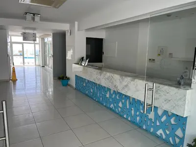 a lobby with a reception counter in a building at Number 10 @ Coralli in Protaras