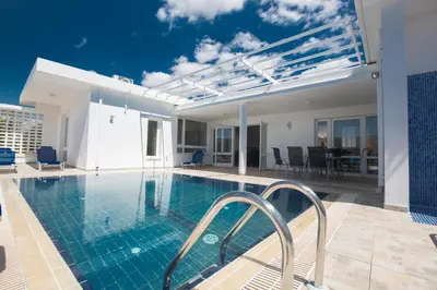 a swimming pool in a house with a house at Napa Nissi House in Ayia Napa