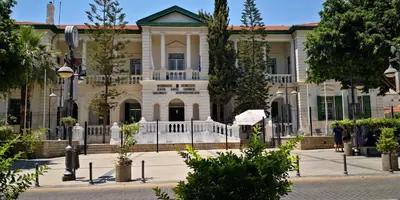 a large house with a white fence in front of it at Chariandry Residence, Limassol City Centre in Limassol