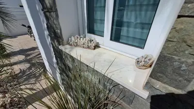 a door to a house with some rocks on it at Relaxing Avra Villa with Private Pool & Garden Near Protaras in Paralimni