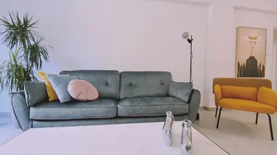 a living room with a couch and a chair at STAY Vital Elegance in Limassol