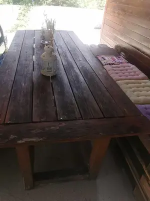a wooden table with a tea pot sitting on top of it at The Mouflon House Pedoulas in Nicosia