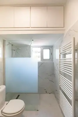 a bathroom with a toilet and a sink at City Center Apartment in Nicosia