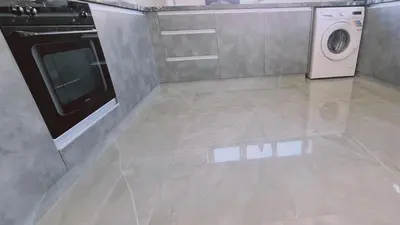 a kitchen with a stove and a washing machine at STAY Centro Apartment in Larnaka