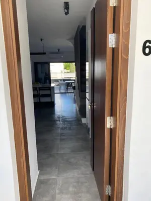 a hallway leading into a house with a door open at Green Bay Area Apartment in Protaras