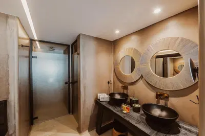 a bathroom with a sink and a shower at Kaliva Suites - Adults Only in Ayia Napa