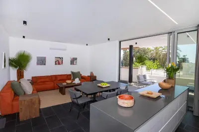 a living room with a couch and a table at Bridge House 201 - 3BR Penthouse in Limassol