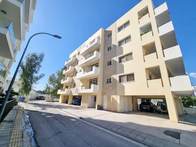 an apartment building on the side of a street at City Vibrance Apartment in Larnaka