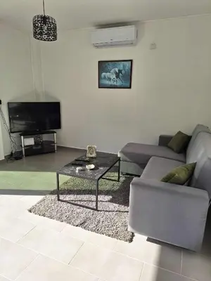 a living room with a couch and a coffee table at Marianna's House in Galata