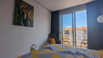 a bedroom with a bed and a large window at Luxury 2-Bedroom Apt. with Seaview in Protaras