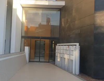 a building with a glass door in front of a building at Deluxe 1 Bed Apt Ayios Dometios in Ayios Dhometios