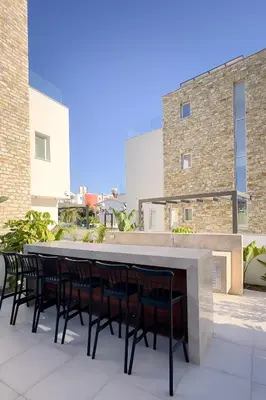 a large table and chairs on a patio at City Napa Seaview Villas - Villa 8 in Ayia Napa
