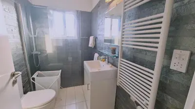 a small bathroom with a sink and a toilet at STAY Mystique Apartment in Limassol