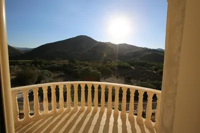 a balcony with a view of a mountain at Villa Melyia in Kato Pyrgos