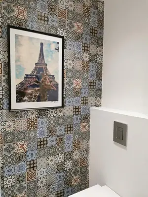a picture of the eiffel tower on a wall at Unique City Centre Apartments in Nicosia