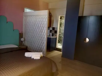 a bedroom with a bed with towels on it at Unique City Centre Apartments in Nicosia