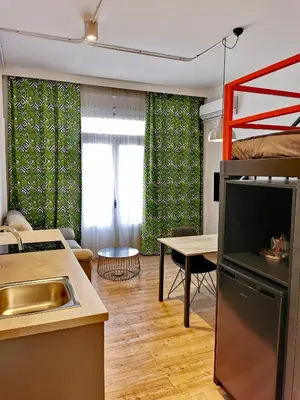 a kitchen and living room with a bunk bed at Unique City Centre Apartments in Nicosia