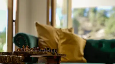 a chess board on a table in front of a couch at Mountain Retreat in Troodos