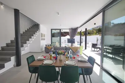 a dining room with a table and chairs at Protaras Elite Pearl Ville Ep3c in Protaras