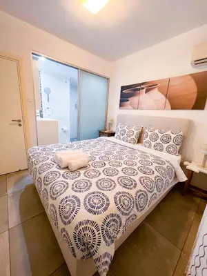 a bedroom with a large bed in a room at Panoramic Sea View Apt - 2bed in Limassol