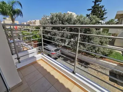 a balcony with a train on the tracks at Mythical Sands BG03 townhouse in Paralimni