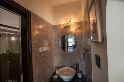 a bathroom with a sink and a mirror at Glabur Stays! The One -1 - Elite Marina Front! in Zygi