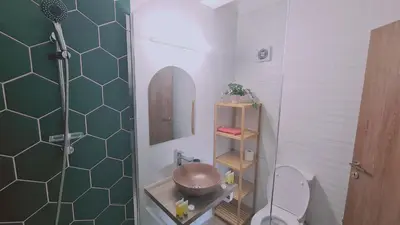 a bathroom with a shower and a toilet and a sink at STAY Sunlit Apartment in Limassol