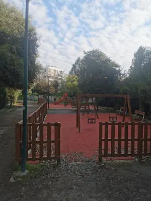 an empty playground with benches and a pole at Cozy 2 Bdr Nicosia City Free Parking Wifi in Nicosia