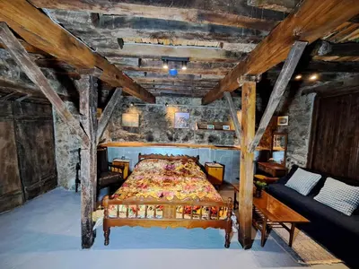 a bedroom with a bed in a room with wooden ceilings at PITHARIA in Askas