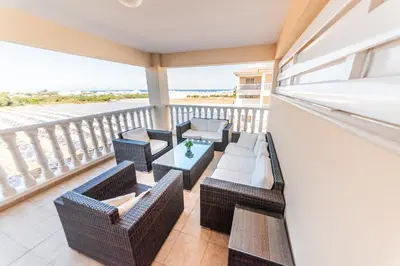 a balcony with wicker chairs and a table at 3 bed, Kapparis, Thea - 3A in Paralimni