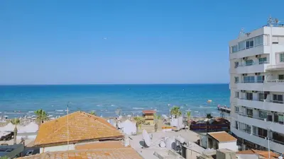 a view of the ocean from a building at STAY Finikoudes Soul in Larnaka