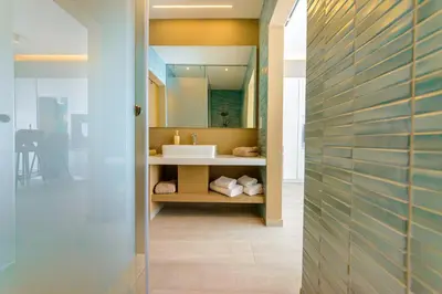 a bathroom with a sink and a mirror at Apartament De Lux MS 1 - C in Paralimni