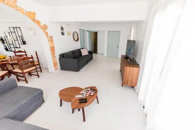 a living room with a couch and a table at 2 bed, Kapparis, Trinidad - 2A in Paralimni