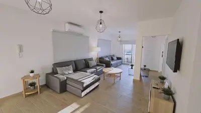 a living room with a couch and a table at STAY Sky Apartment in Limassol