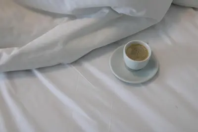 a cup of coffee sitting on a white table at Hypnos Residence in Nicosia