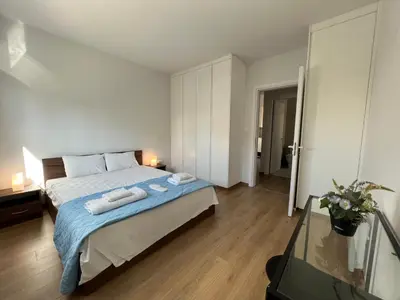 a bedroom with a bed with two towels on it at Prince Boutique Apartment/1BR in Nicosia