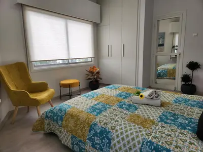 a bedroom with a bed with a stuffed animal on it at Luxury Kalipso Beachfront in Limassol