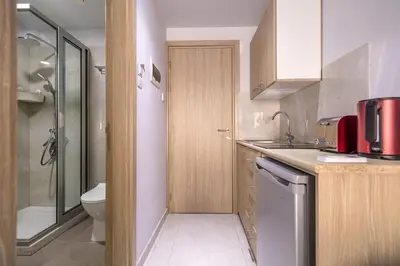a small bathroom with a toilet and a sink at Paul Marie Hotel Apartments in Ayia Napa