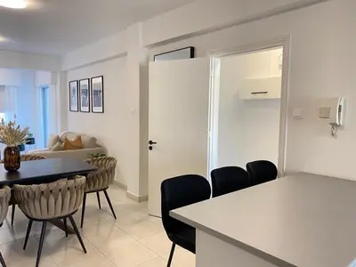 a kitchen and dining room with a table and chairs at Central Boutique Twenty One in Nicosia