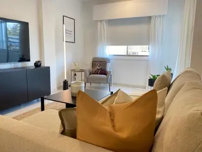 a living room with a couch and a table at Central Boutique Twenty One in Nicosia